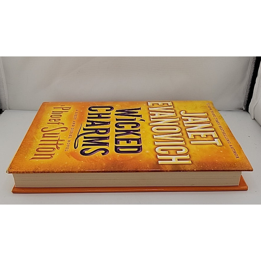 Wicked Charms : A Lizzy and Diesel Novel by Phoef Sutton and Janet Evanovich...