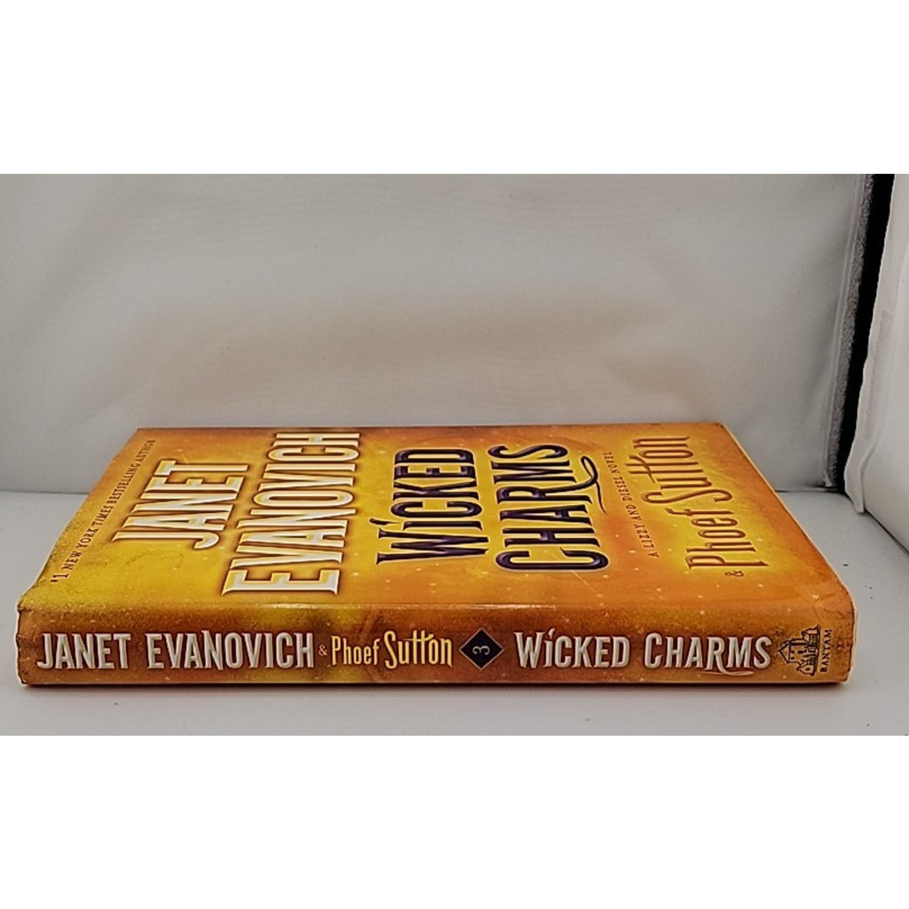 Wicked Charms : A Lizzy and Diesel Novel by Phoef Sutton and Janet Evanovich...